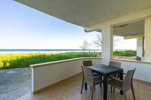 Property building, Patio, Facade/entrance, Day, Natural landscape, View (from property/room), Balcony/Terrace, Balcony/Terrace, Dining area, Beach, Beach, Sea view, Sea view, Inner courtyard view