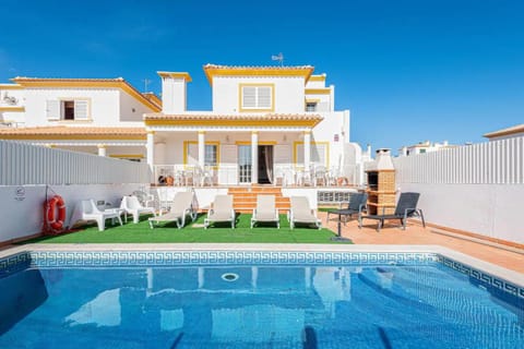 Property building, Patio, Pool view, Swimming pool, sunbed