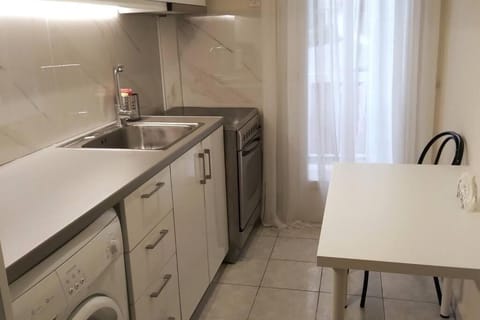 Kitchen or kitchenette, washing machine