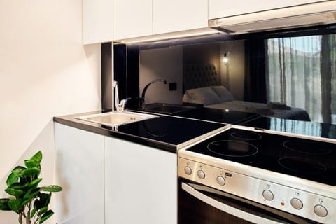 Kitchen or kitchenette, stove, washing machine