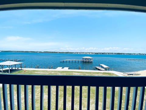 Sea Oats E202 by ALBVR - Pet Friendly Direct Lagoon Front Renovated 2BR, 2BA Condo, Outdoor Pools, Pier, and Dedicated Beach Access House in West Beach
