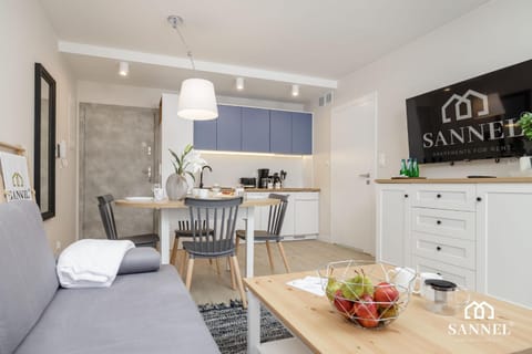 Property logo or sign, TV and multimedia, Coffee/tea facilities, Kitchen or kitchenette, Living room, Decorative detail, Decorative detail, Seating area, Dining area, On site
