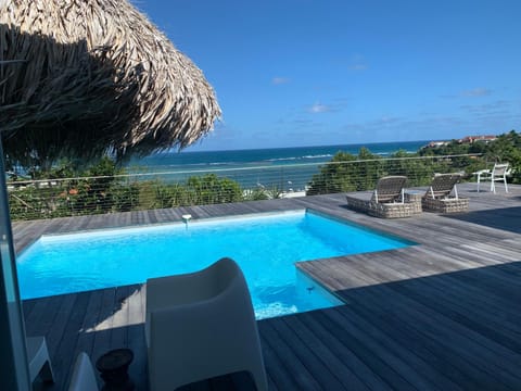 View (from property/room), Pool view, Sea view, Swimming pool, sunbed