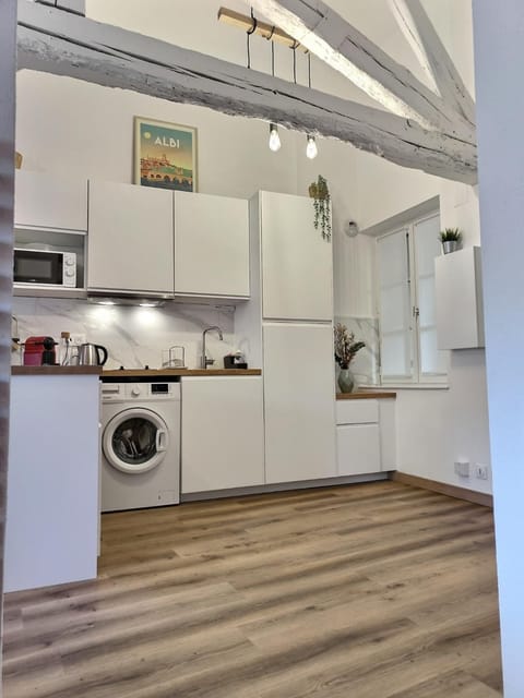 Kitchen or kitchenette, washing machine