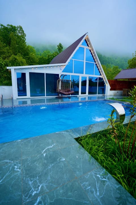 Property building, Day, Natural landscape, Pool view, Swimming pool