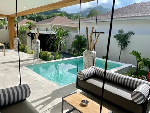 Property building, Patio, Day, Natural landscape, Seating area, Pool view, Swimming pool