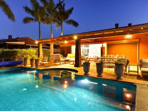 Property building, Patio, Night, Pool view, Swimming pool, sunbed