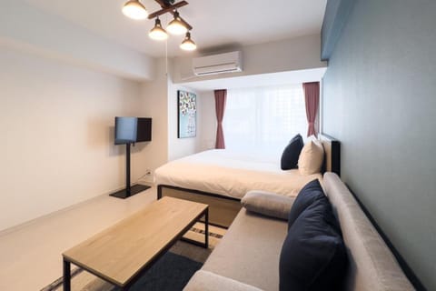 Bed, TV and multimedia, Seating area, Bedroom, air conditioner