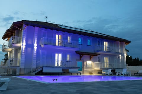 Property building, Night, Pool view, Swimming pool, sunbed