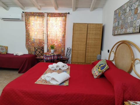 Bed, Photo of the whole room, Seating area, Bedroom, towels, air conditioner
