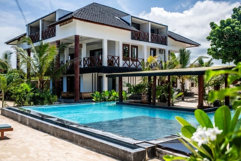 Property building, Patio, Day, Garden, View (from property/room), Balcony/Terrace, Garden view, Pool view, Swimming pool, sunbed