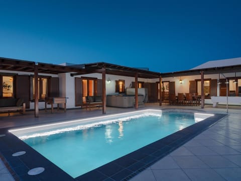 Property building, Patio, Night, Pool view, Swimming pool
