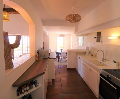 Kitchen or kitchenette, dishwasher, oven, stove, toaster