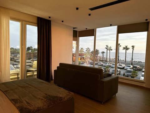 Bed, View (from property/room), Balcony/Terrace, Seating area, Sea view, Parking