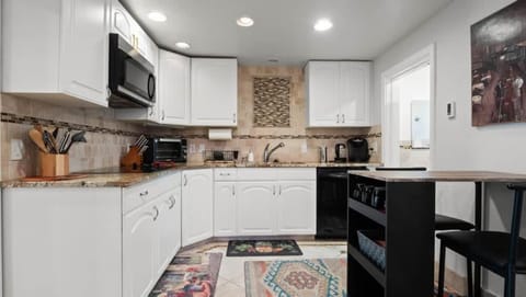 Kitchen or kitchenette, dishwasher, stove, toaster