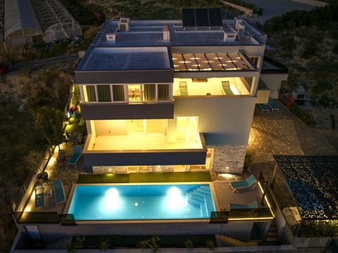 Property building, Night, Pool view, Swimming pool, sunbed