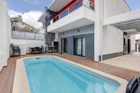 Property building, Living room, Swimming pool