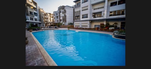 Property building, Pool view, Swimming pool, sunbed