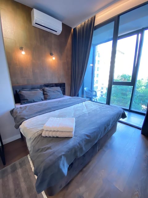 Bed, Photo of the whole room, Bedroom, towels, air conditioner