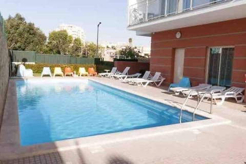 Property building, Patio, Swimming pool, Swimming pool, sunbed