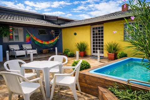Property building, Patio, Day, Natural landscape, Pool view, Swimming pool