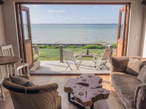 Patio, Day, Natural landscape, View (from property/room), Balcony/Terrace, Living room, Seating area, Dining area, Beach, Sea view