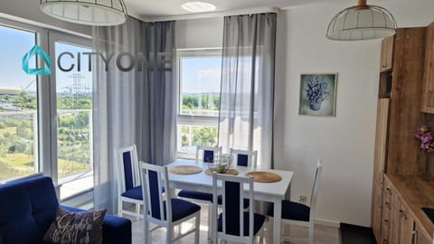 View (from property/room), Living room, Seating area, Dining area, City view