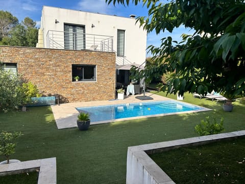 Property building, Garden, Pool view, Swimming pool, sunbed
