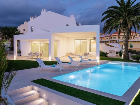 Property building, Patio, Night, Pool view, Swimming pool, sunbed