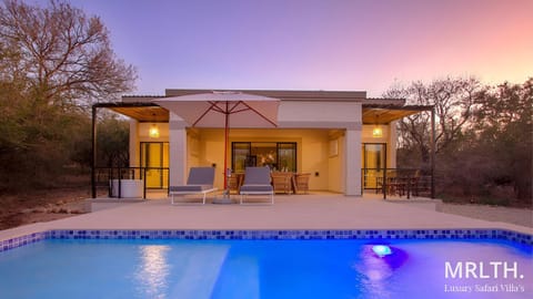Property building, Patio, Day, Natural landscape, Pool view, Swimming pool, sunbed