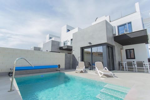 Property building, Patio, Pool view, Swimming pool, sunbed