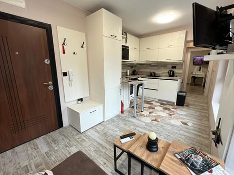 Communal lounge/ TV room, Dining area, kitchen, air conditioner