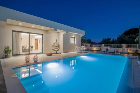 Property building, Patio, Night, Pool view, Swimming pool, sunbed
