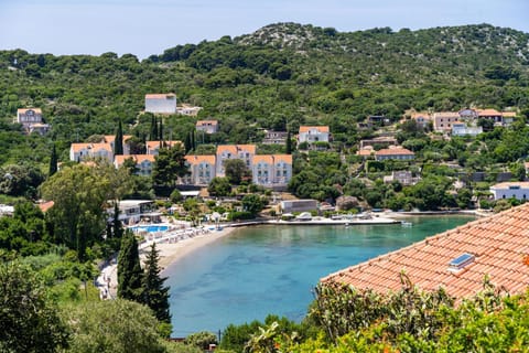 Property building, Nearby landmark, Off site, Day, Natural landscape, Beach, City view, Sea view