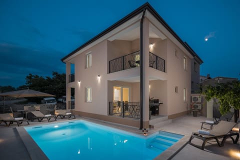 Property building, Patio, Night, Pool view, Swimming pool, Swimming pool, sunbed