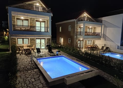 Property building, Patio, Night, Pool view, Swimming pool, sunbed
