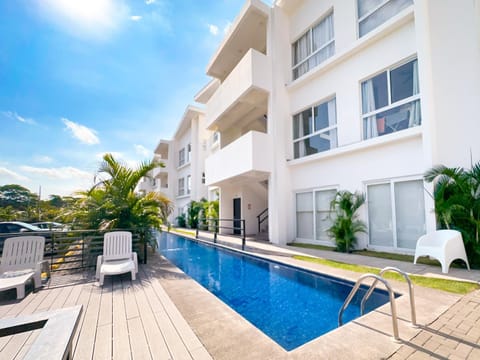 Property building, Patio, Swimming pool, sunbed