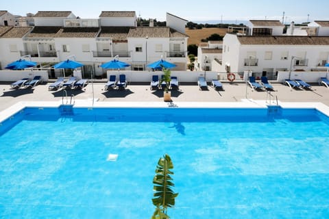 Property building, Living room, Swimming pool
