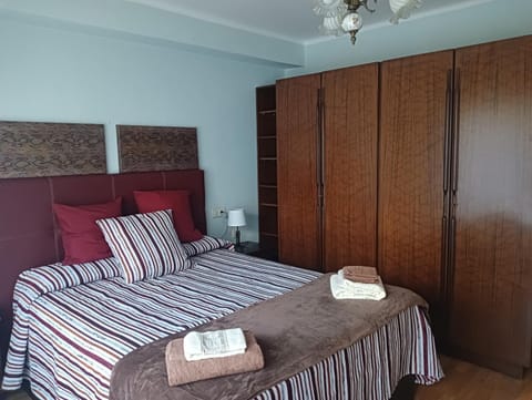 Property building, Bed, Bedroom, towels, wardrobe