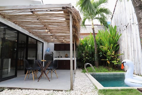 Property building, Patio, Day, Garden, Seating area, Dining area, Garden view, Pool view, Swimming pool
