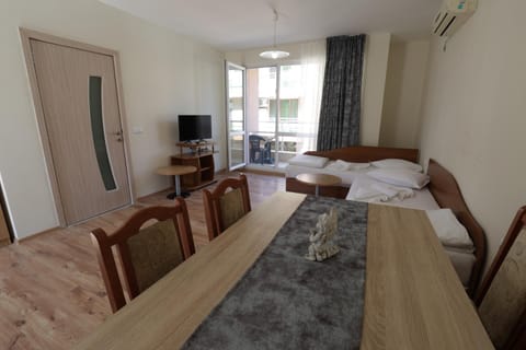 Bed, TV and multimedia, Living room, Seating area, wardrobe, air conditioner