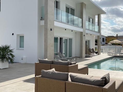 Property building, Patio, Off site, Balcony/Terrace, Swimming pool, sunbed