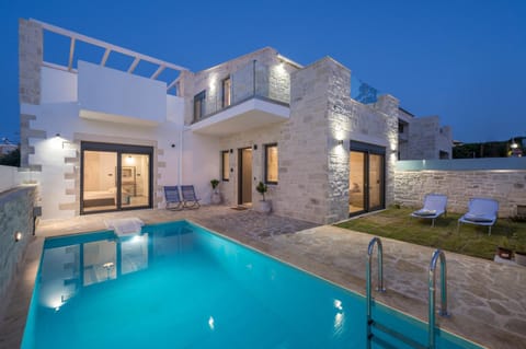 Property building, Patio, Night, Pool view, Swimming pool, Swimming pool, sunbed