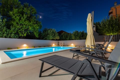 Patio, Night, Pool view, Swimming pool, sunbed