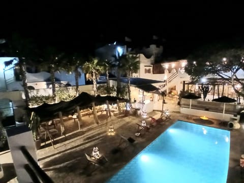 Property building, Patio, Night, Pool view, Swimming pool, sunbed