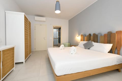 Bed, towels, wardrobe, air conditioner