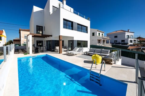 Property building, Patio, Pool view, Swimming pool, sunbed