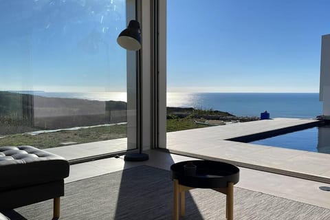 Patio, Natural landscape, Living room, Seating area, Pool view, Sea view, Swimming pool