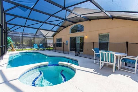 Property building, Patio, Pool view, Swimming pool, sunbed