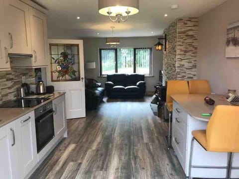 Kitchen or kitchenette, Living room, Seating area, Dining area, dishwasher, microwave, oven, stove, toaster